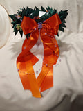 Corona d'alloro con fiori decorativi